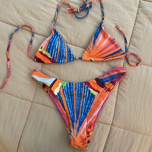 Shein size medium multi colored print bikini. Never worn
